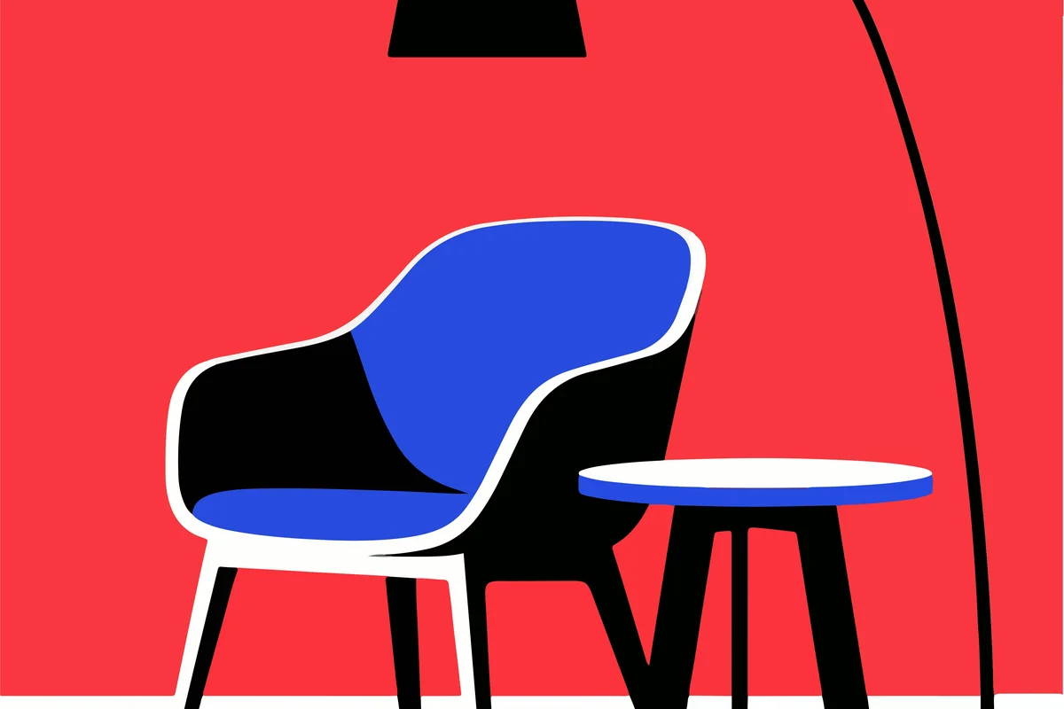 A graphic blue chair and floor lamp against a bold red background