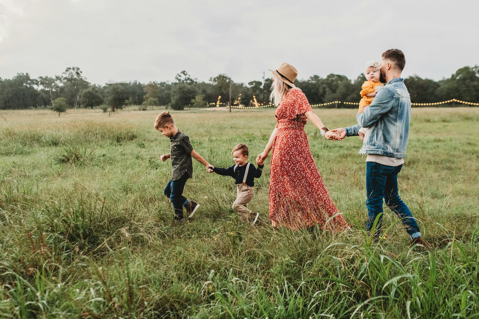 A family walking together through an open field