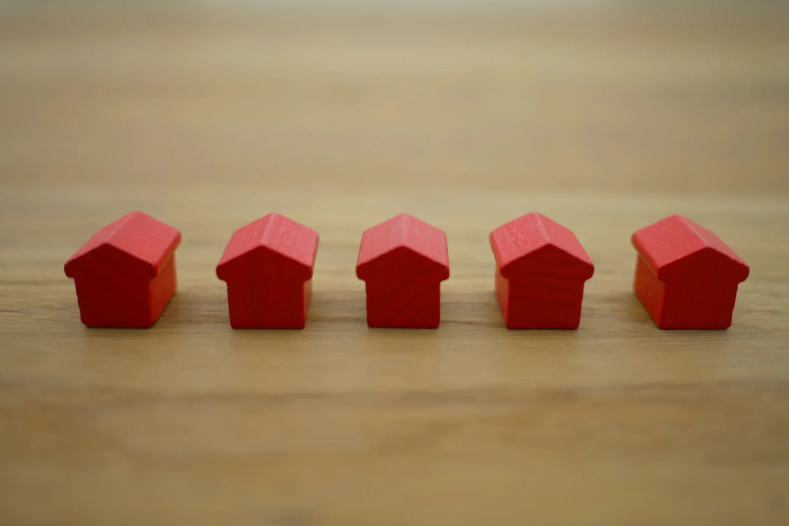 A row of small red wooden houses representing residential care choices